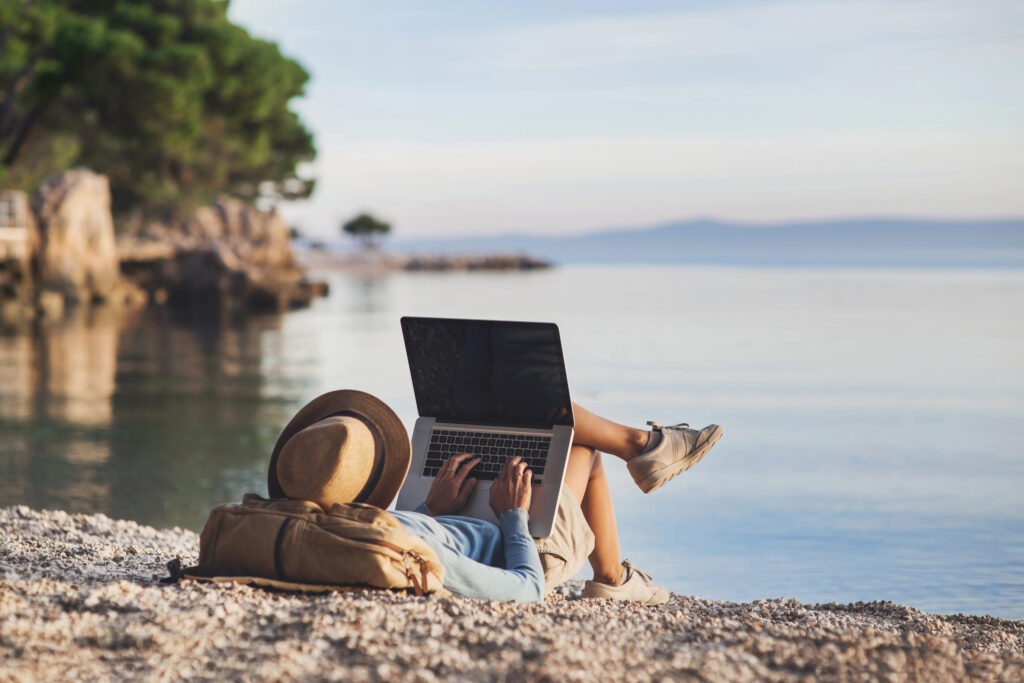 People using devices to plan trips, check in to hotels and flights, stay connected to family and office. Freelance business concept