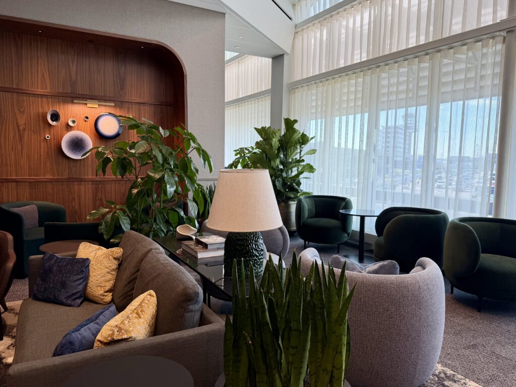 Seating and foliage at the Amex Centurion Lounge AMS.