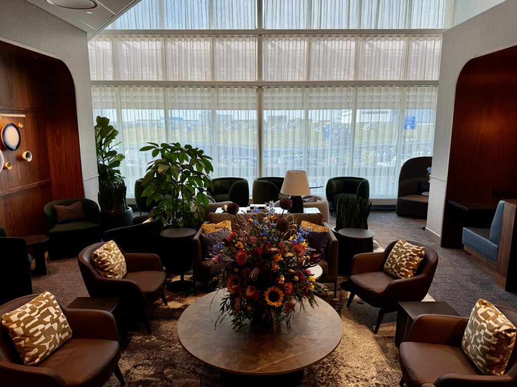 Seating and foliage at the Amex Centurion Lounge AMS.