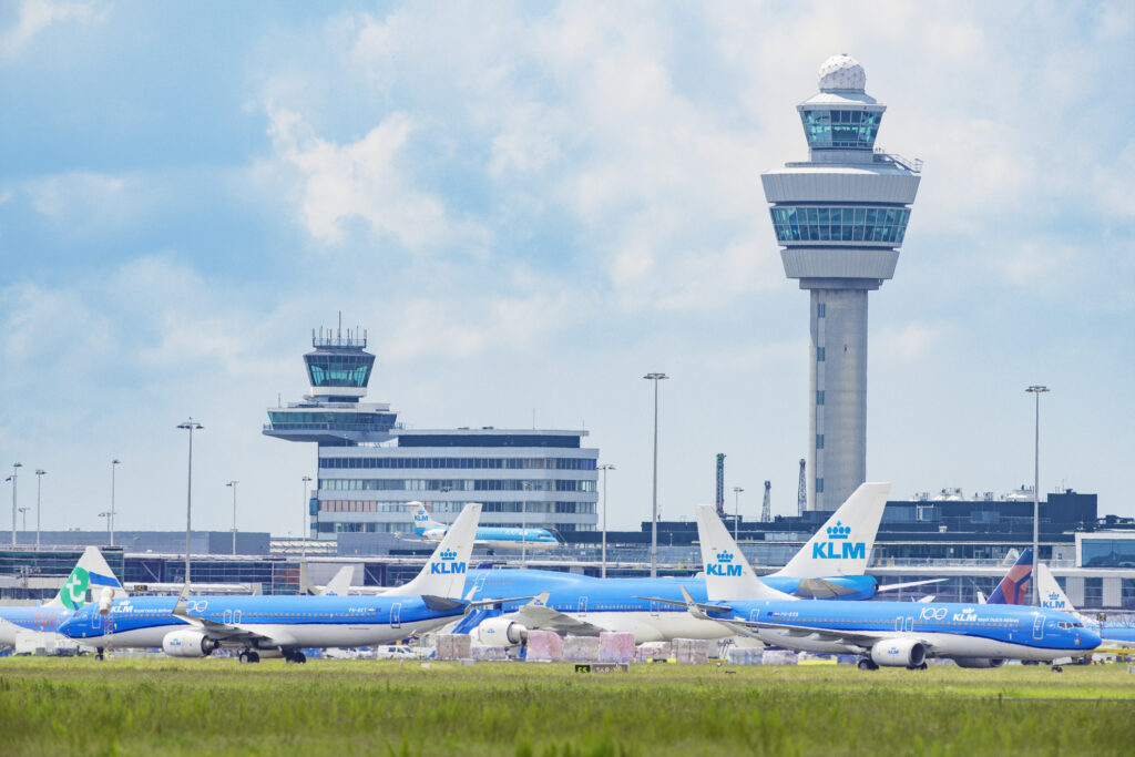 KLM (Koninklijke Luchtvaart Maatschappij - Royal Dutch Airlines) airplanes parked on the tarmac of Schiphol Airport near Amsterdam
