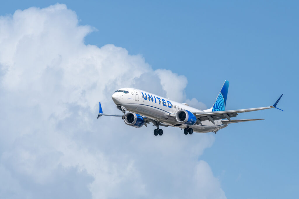 United Airlines airplane (Boeing 737 MAX 9) landing at Miami International Airport. United Airlines is the third-largest airline in the world after its merger with Continental Airlines.