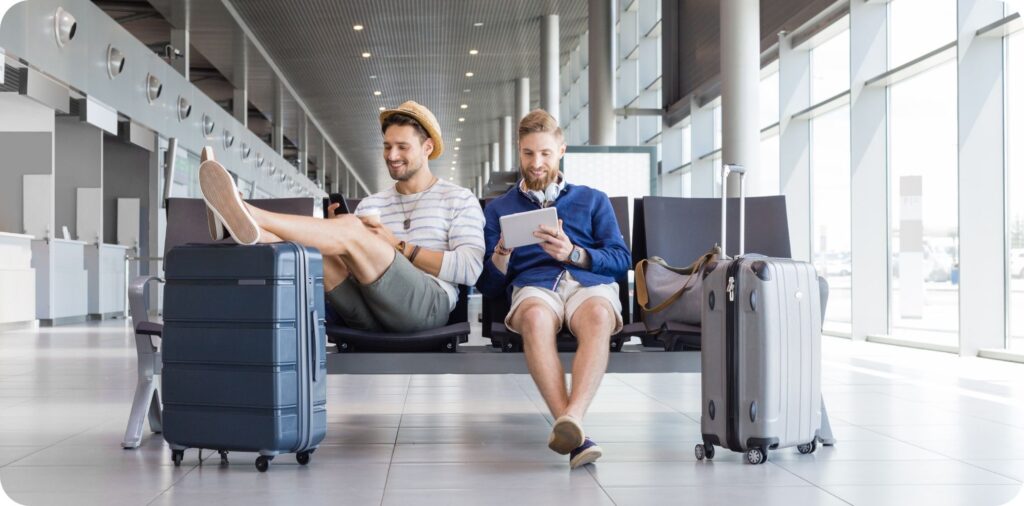 Travel companions waiting for flight at airport