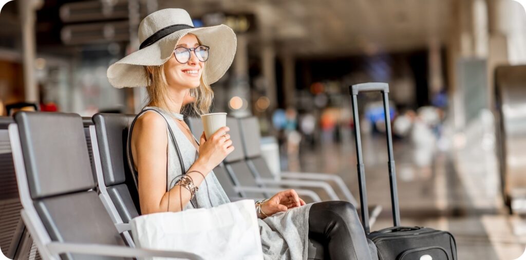 Happy digital nomad waiting to board her flight