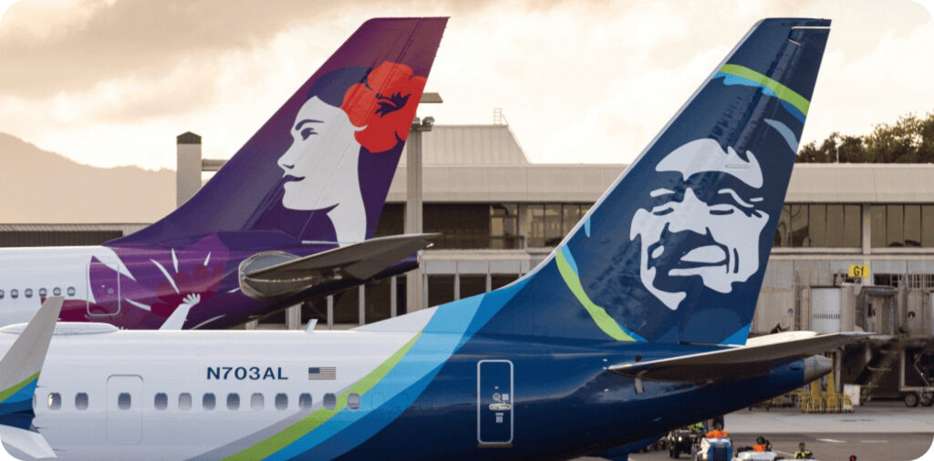 Tail photo of a hawaiian and alaska airplane