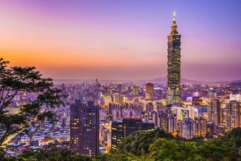 Modern office buildings in Taipei, Taiwan at dusk.
