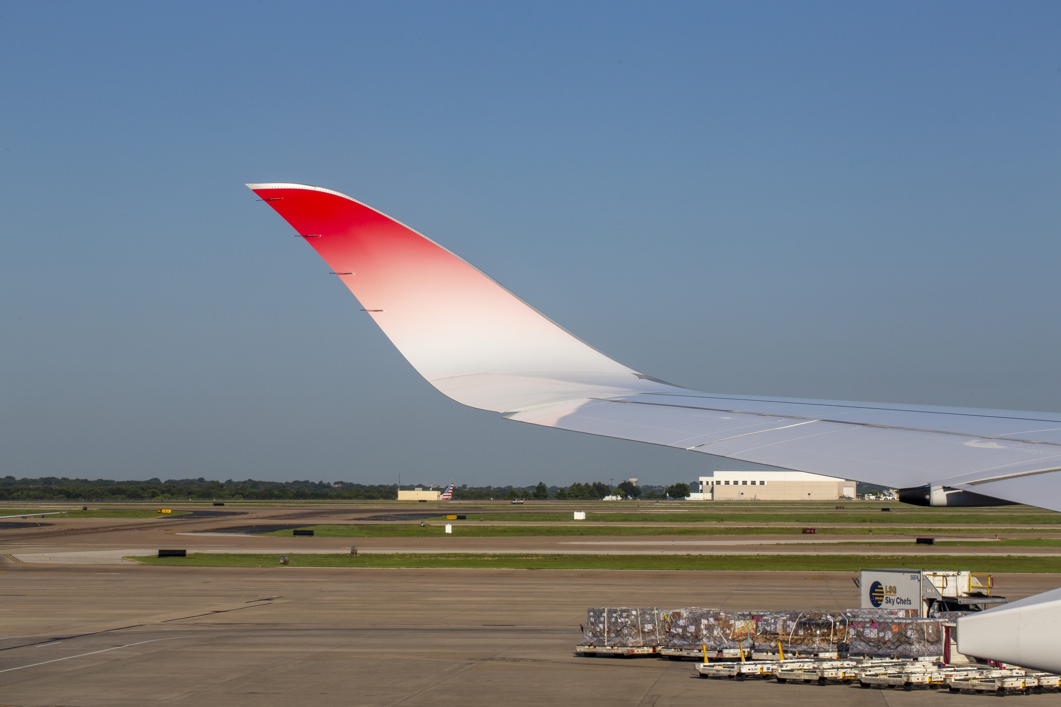 Wing tip of Japan Airlines Airbus A350-1041 aircraft with registration JA01WJ at Dallas/Fort Worth International Airport in June 2024